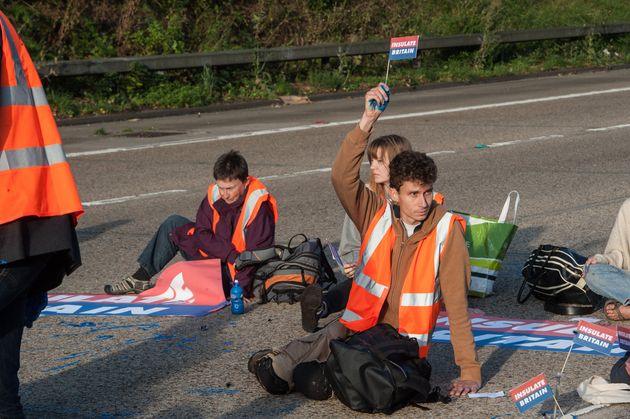 <strong>Protestors from Insulate Britain block the M25 motorway near Cobham in Surrey.</strong>