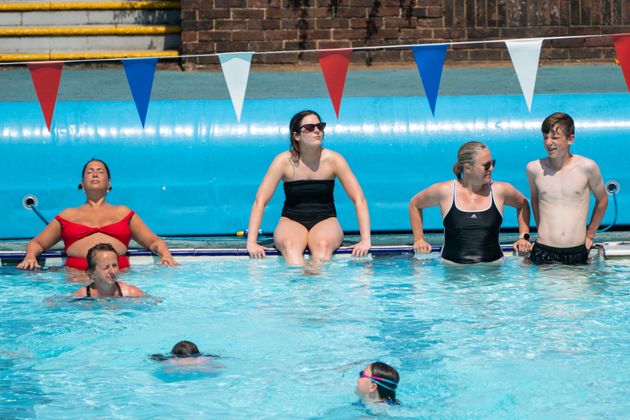 Swimmers soak up the sun at Charlton Lido in south east London.