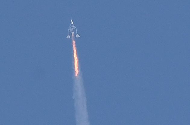 The Virgin Galactic SpaceShipTwo space plane Unity and its mothership separate as they fly above Spaceport America, near Truth and Consequences, New Mexico, on Sunday.