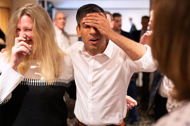 Britain's former chancellor to the exchequer and candidate to be the Leader of the Conservative Party, and Britain's next Prime Minister Rishi Sunak, reacts as he meets with supporters during a campaign event in Newmarket, on July 27, 2022. - Rishi Sunak and Liz Truss are contesting a run-off to be the Conservatives' new leader, and thereby prime minister, with the ruling party's approximately 200,000 members set to vote next month. The winner to replace outgoing Prime Minister Boris Johnson will be announced on September 5, 2022. (Photo by Joe Giddens / POOL / AFP) (Photo by JOE GIDDENS/POOL/AFP via Getty Images)