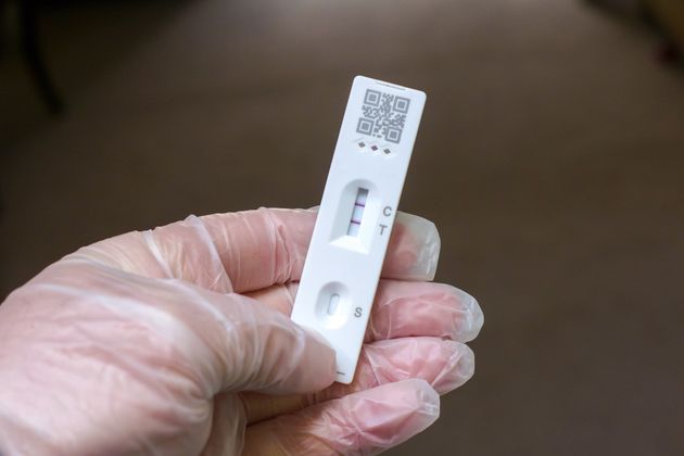 A lateral flow test showing positive results for a Covid infection