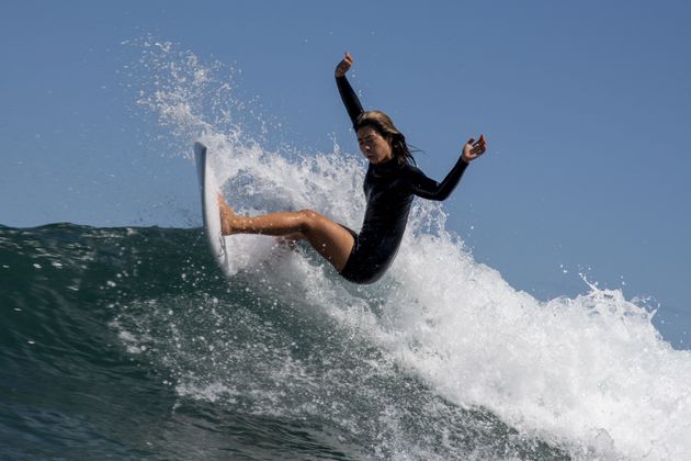 Japan's Mahina Maedagoes rides a wave during a free training session at the Tsurigasaki Surfing Beach, in Chiba, on July 24, 2021 during the Tokyo 2020 Olympic Games. 