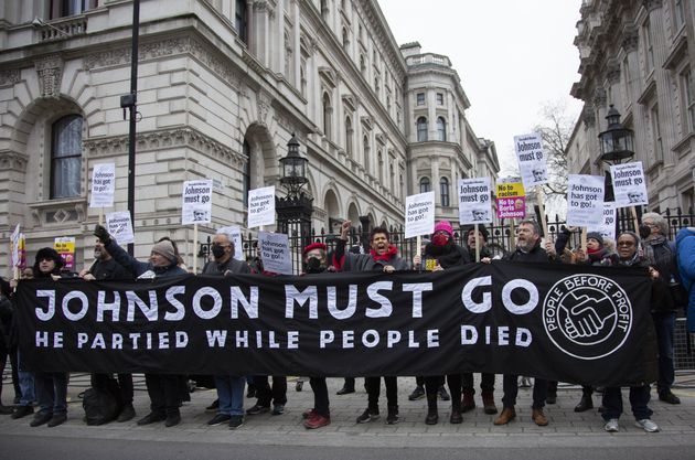 People protest against Boris Johnson outside the Prime Minister's Office on 10 Downing Street in London.