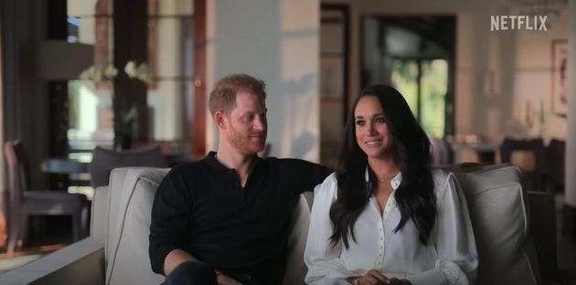 The Duke and Duchess of Sussex pictured speaking in their new documentary, 