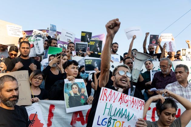 Protesters shout slogans at central Syntagma square in Athens on Saturday during a protest against the death of Iranian Mahsa Amini, 