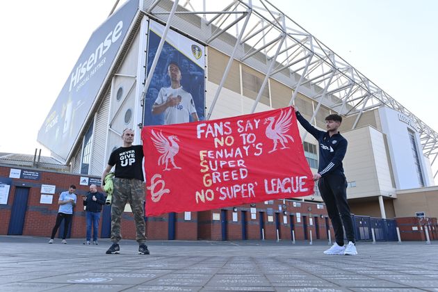 <strong>Fans hold a banner outside Elland Road.</strong>