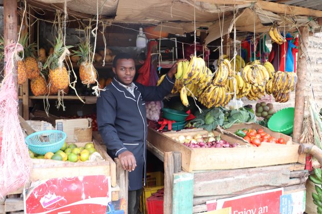 Joseph-Lowasa-Baraka-in-his-vegetable-and-fruit-kiosk-in-Nairobi-1-629x419.jpg