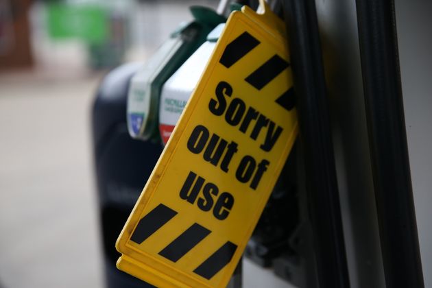 <strong>Out of use sign is attached to pumps at a petrol station in London.</strong>