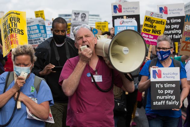 NHS staff marching from St Thomas' Hospital to Downing Street to protest last year. 