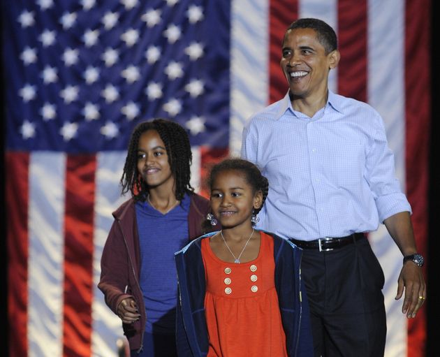 Obama and his daughters Sasha at a rally at JFK Stadium in Springfield, Missouri, Nov. 1, 2008. 