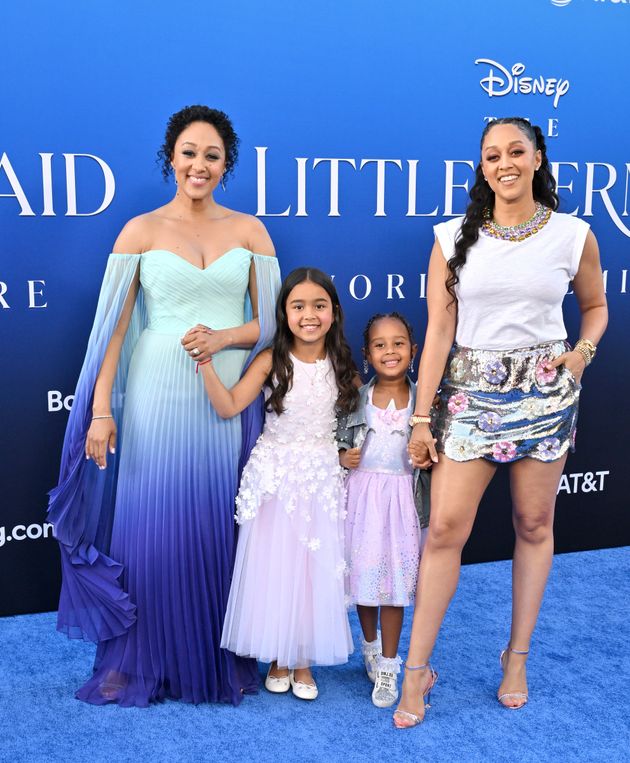 Tamera Mowry-Housley with her daughter, Ariah, and Tia Mowry with her daughter, Cairo, attend the world premiere of Disney's live-action 