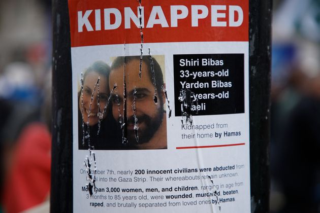 A damaged poster on a lamppost shows an image of Israeli citizens who have allegedly been kidnapped by the militant group Hamas, during a pro-Palestinian demonstration in London, Saturday, Oct. 21, 2023.